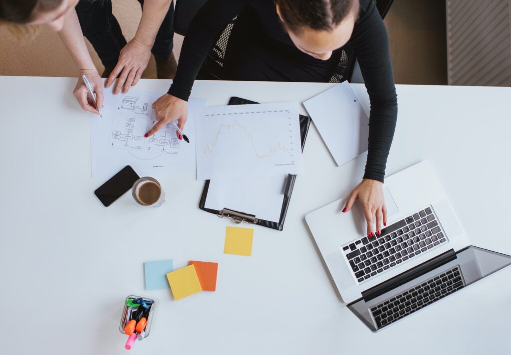 Business team working on a new plan with laptop